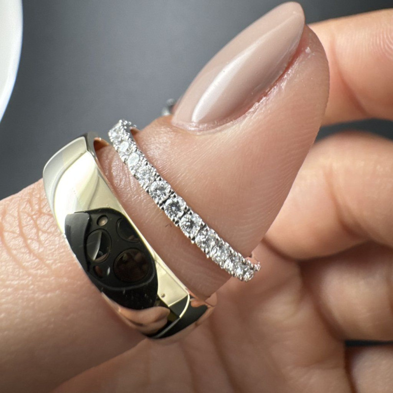 A Pair of Wedding Rings in White and Yellow Gold with a Diamond Band – photo 3 of 3