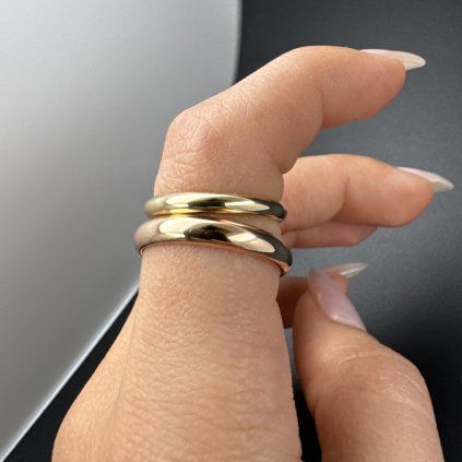 A Pair of Elegant Engagement Rings in Yellow and Rose Gold