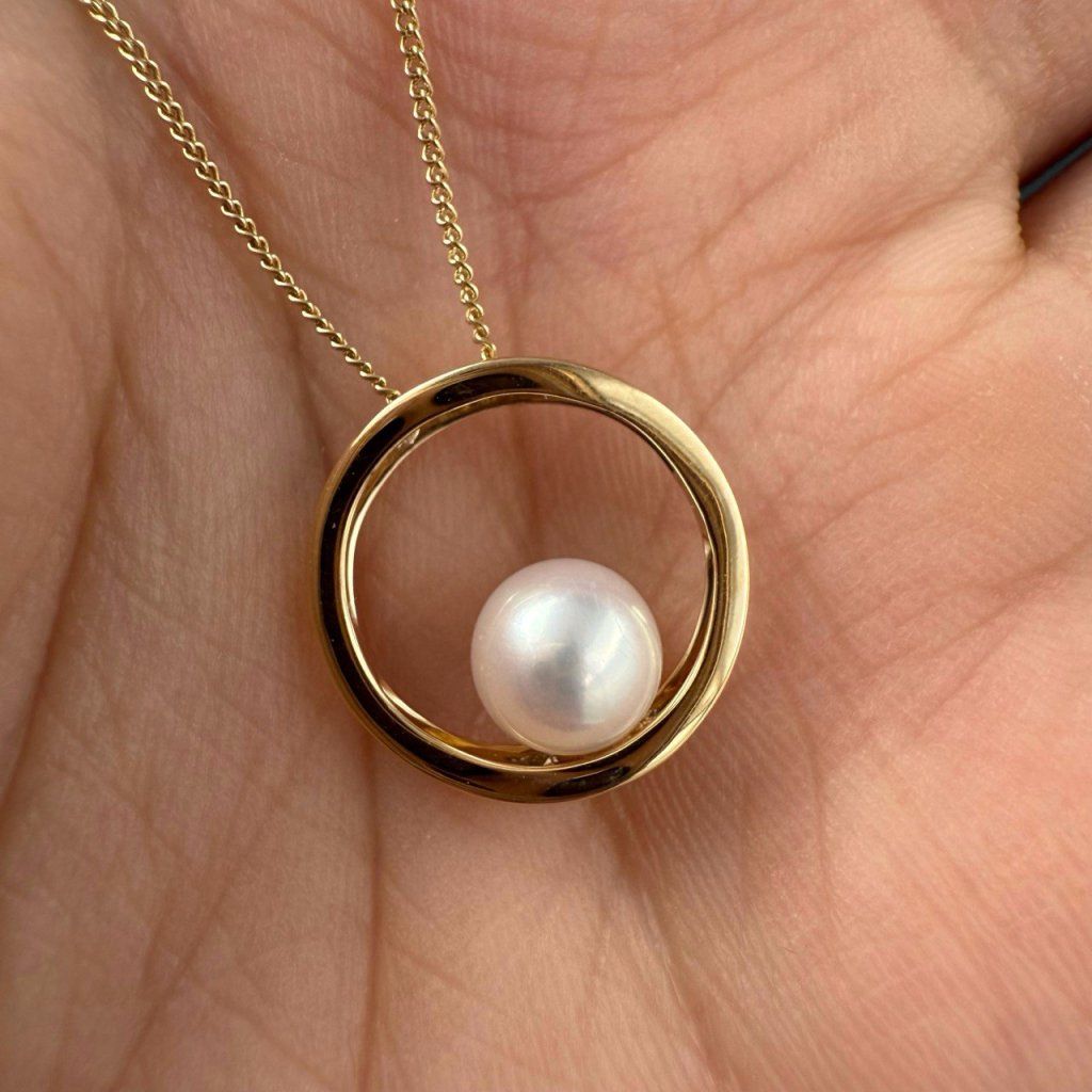 Gold Pendant with River Pearl in a Circular Hoop – photo 1 of 3