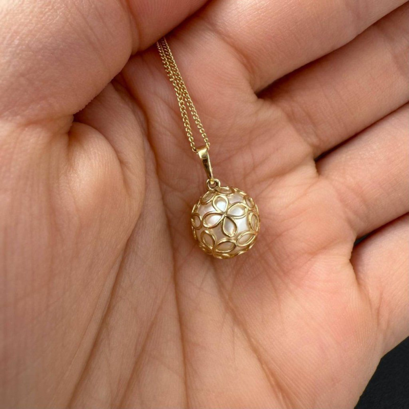 Gold Pendant with a River Pearl in a Delicate Openwork Sphere – photo 2 of 3