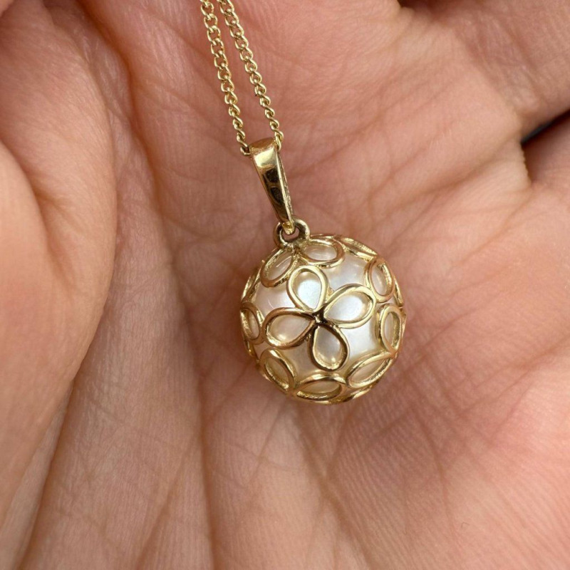 Gold Pendant with a River Pearl in a Delicate Openwork Sphere – photo 1 of 3