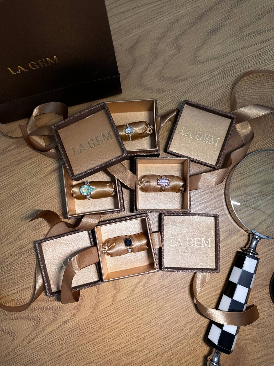 LA GEM gift packaging: bronze boxes lined with satin, embroidered with the house name