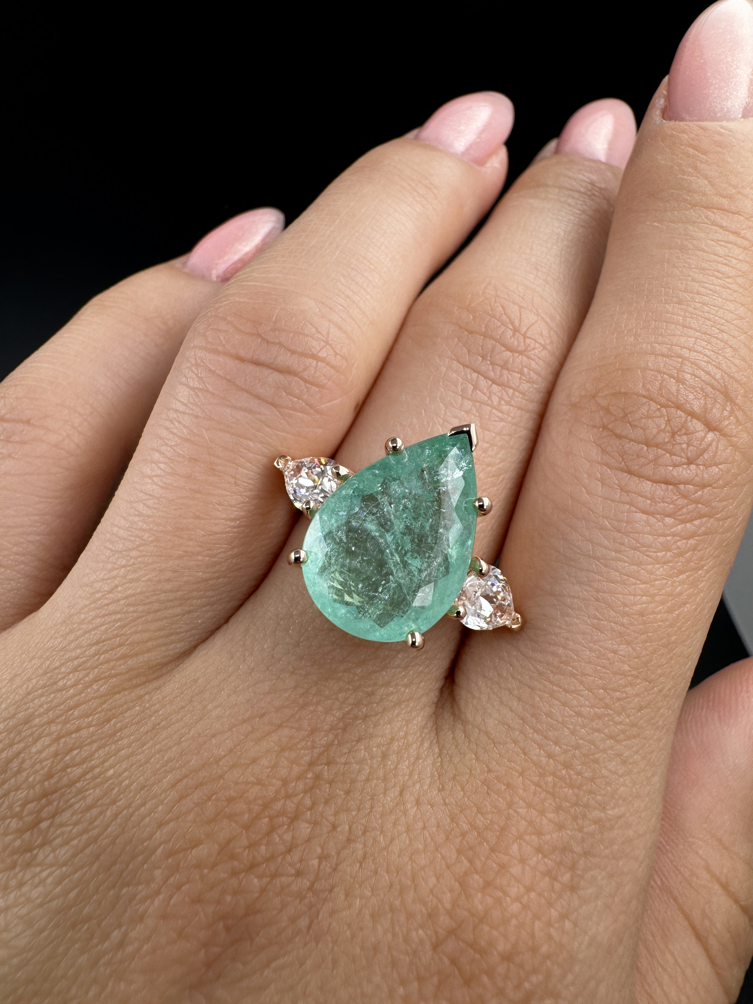 Pear-shaped Paraíba trilogy ring worn on the hand