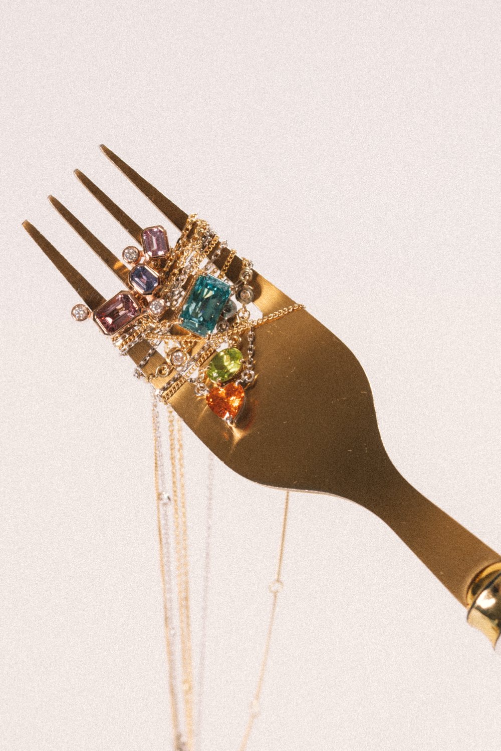 A cluster of jewellery set with rare natural coloured gemstones